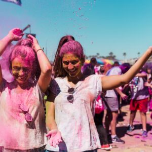 two-women-enjoying-playing-with-holi-powder