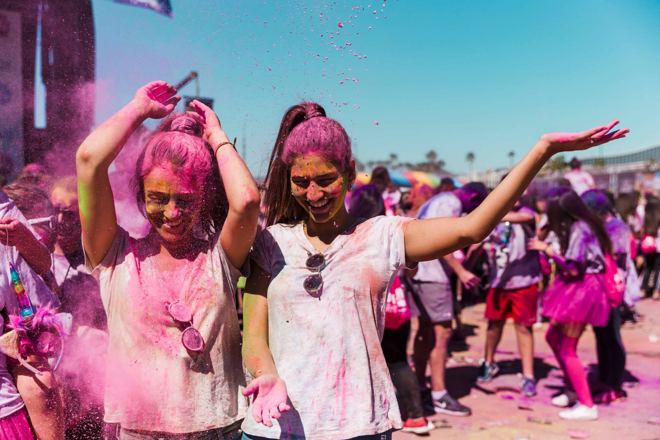 two-women-enjoying-playing-with-holi-powder